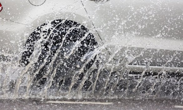 car on wet road small.jpg