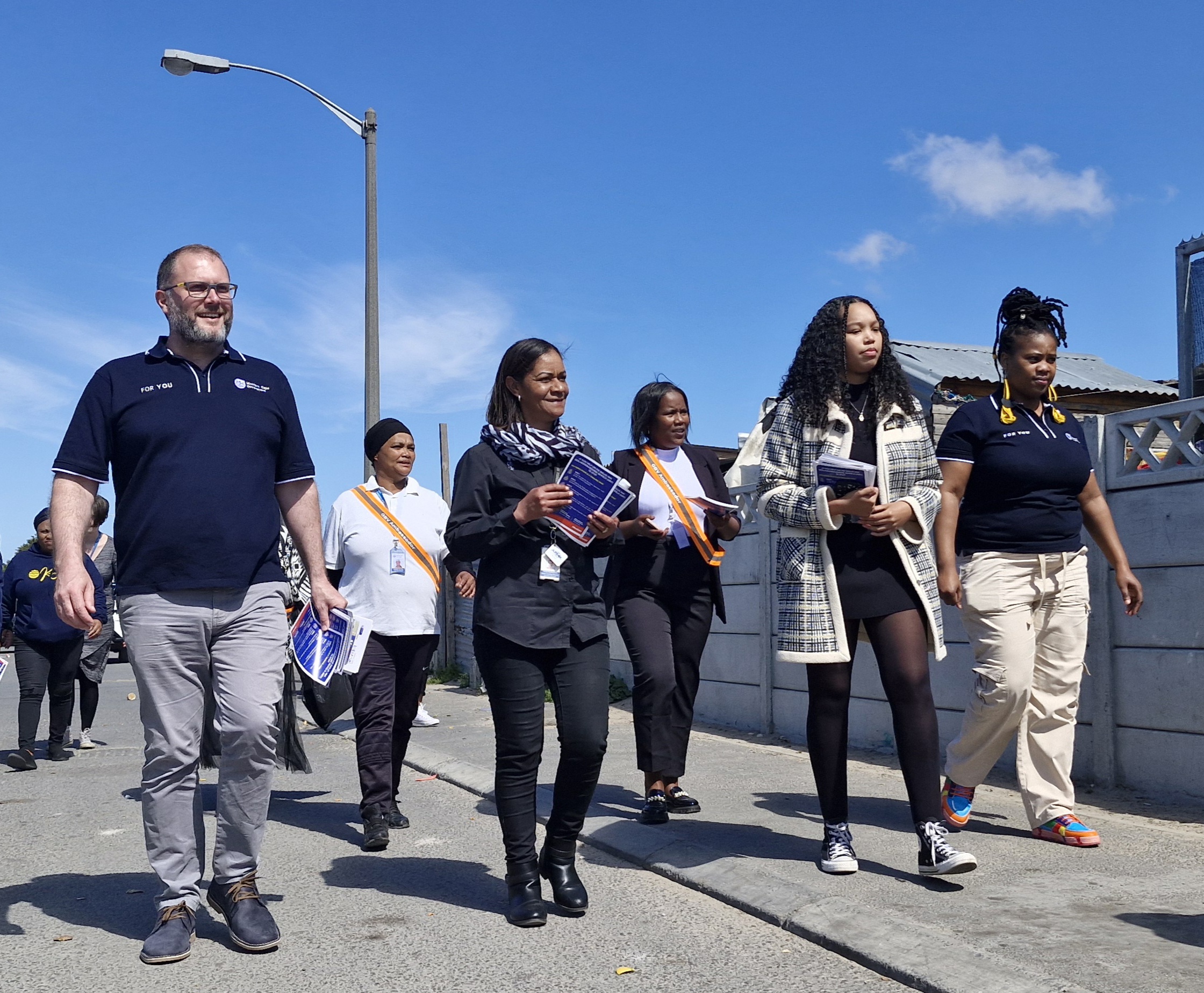 Western Cape Minister of Social Development, Jaco Londt doing a door-to-door GBV awareness blitz with GBV ambassadors and DSD staff