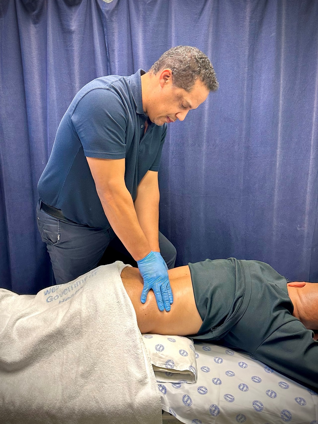 Physiotherapist, Nicholas Claasen treating back pain.