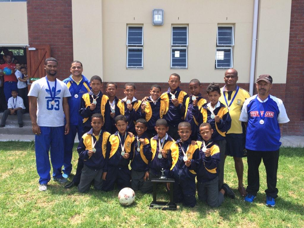 The u12 soccer team basking in the glory of their achievement