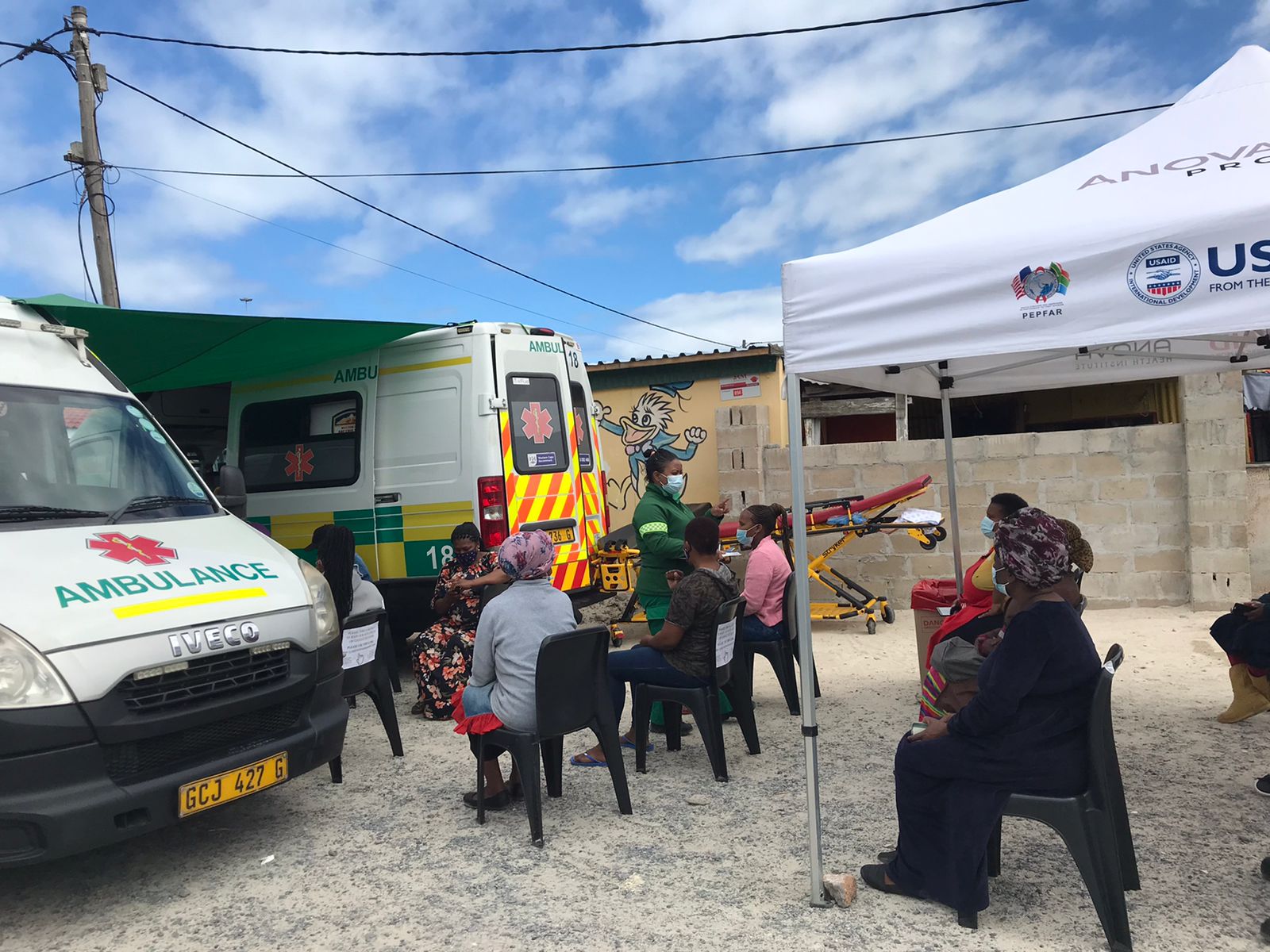 WCGH Emergency Medical Services (EMS) Vaxi Taxi: Community members waiting to be vaccinated at Makaza Kitchen in Khayelitsha. 