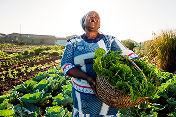 South African woman in vegetable garden
