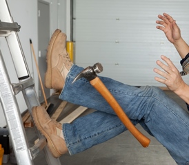 Worker falling from a ladder with a hammer hanging in the air