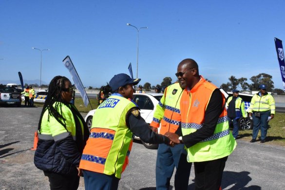 The Western Cape Mobility Minister Isaac Sileku surpporting officials at the all-female roadblock to launcg Women's Month.jpg